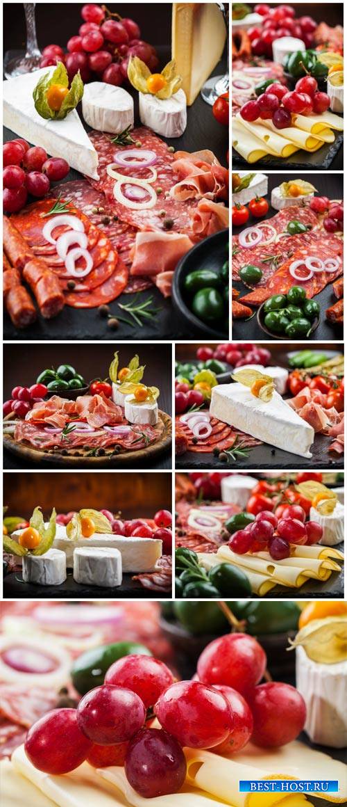 Meat products, cheese, grapes - stock photos
