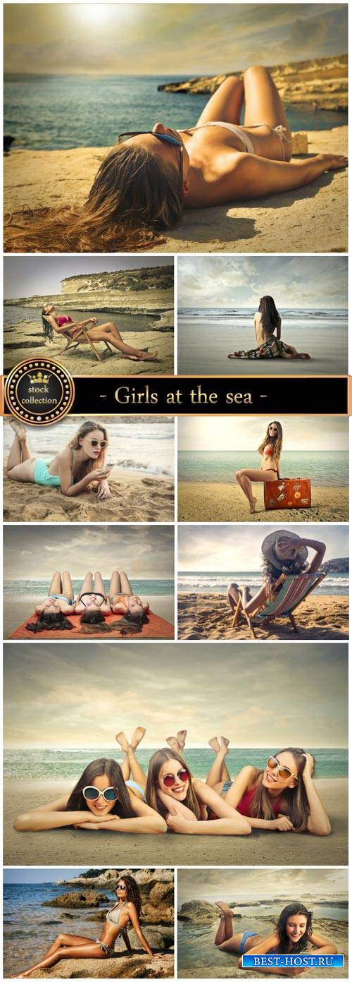 Girls at the sea, summer holidays - stock photos