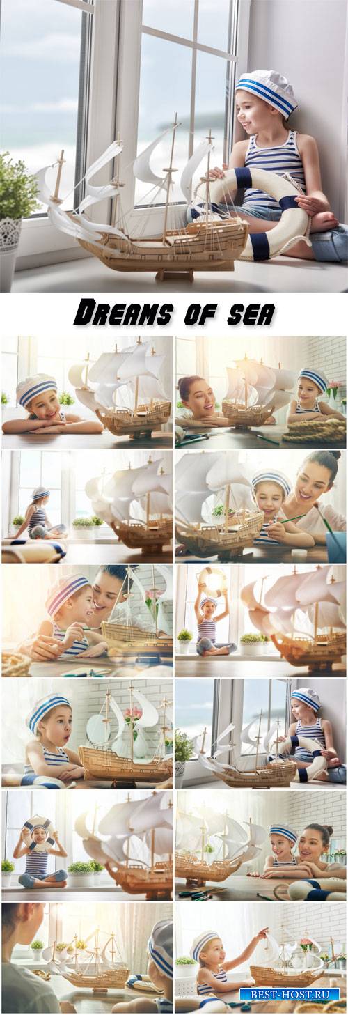 Dreams of sea, adventures and travel, mother and her child making model ship