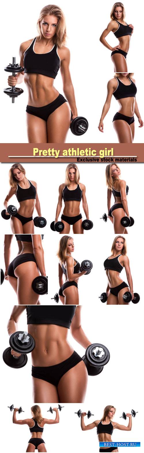 Pretty athletic girl with dumbbells