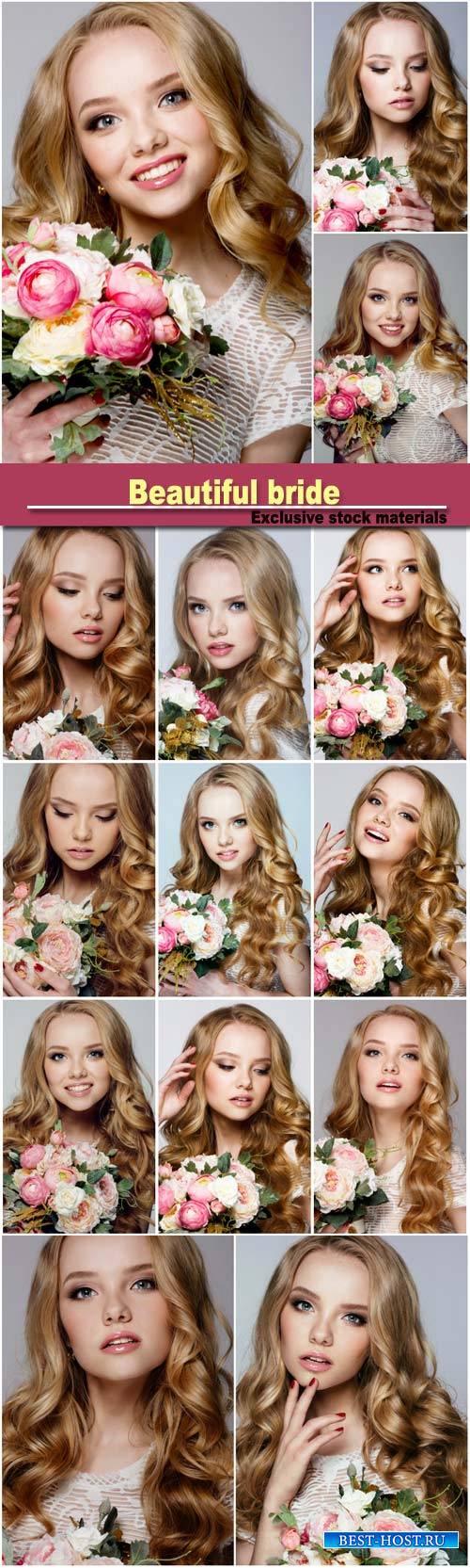 Portrait of beautiful bride with stylish make-up and hairdo holding bouquet in her hands