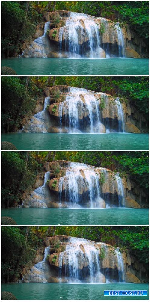 Footage Waterfall in tropical rainforest flows in emerald pond