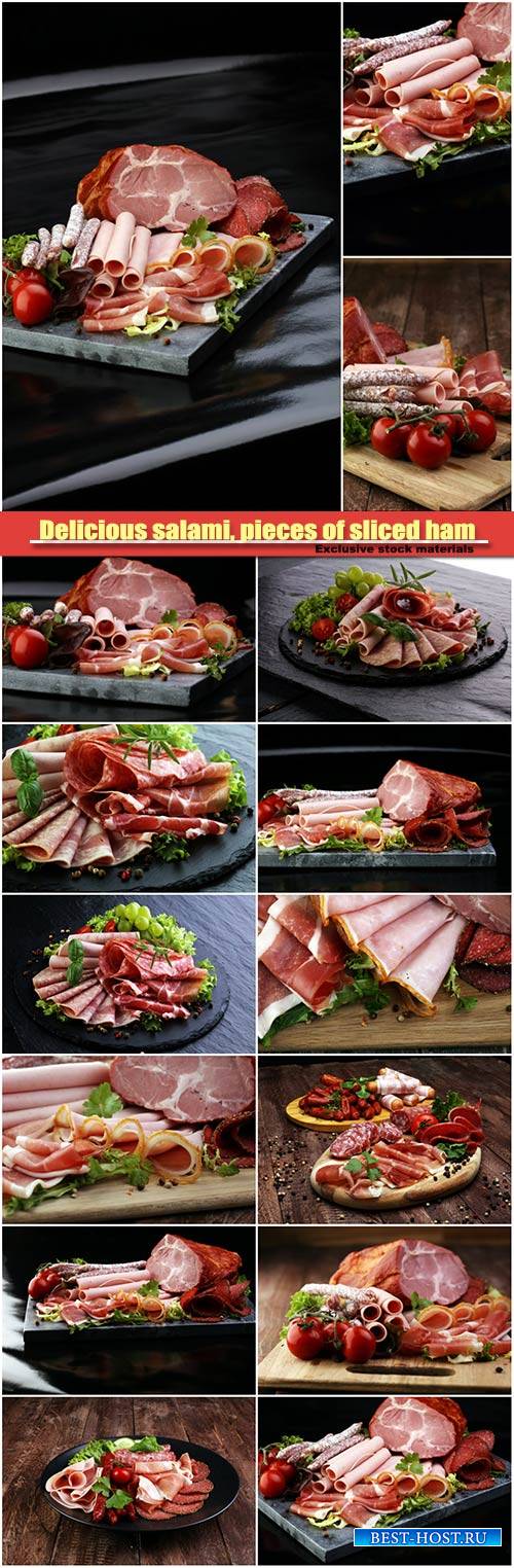 Delicious salami, pieces of sliced ham, sausage, tomatoes, salad and vegetable