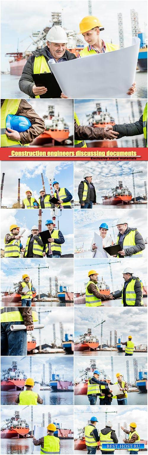 Construction engineers discussing documents in a port