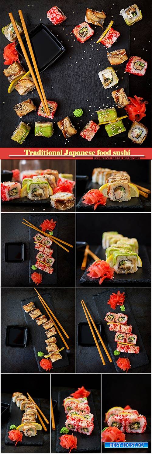 Traditional Japanese food sushi, rolls and sauce on a black background
