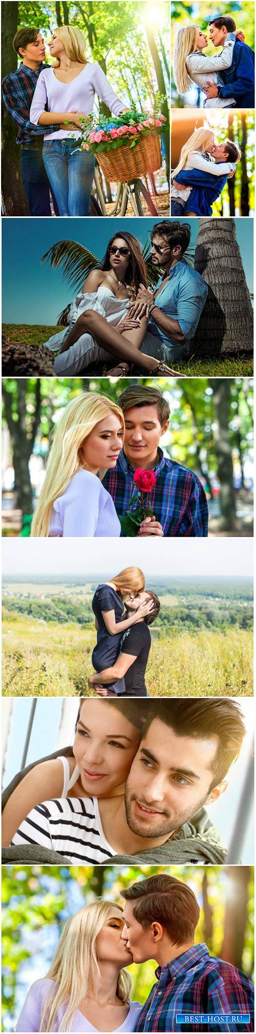 Young couple outdoor portrait, beautiful pretty girl kissing handsome boy
