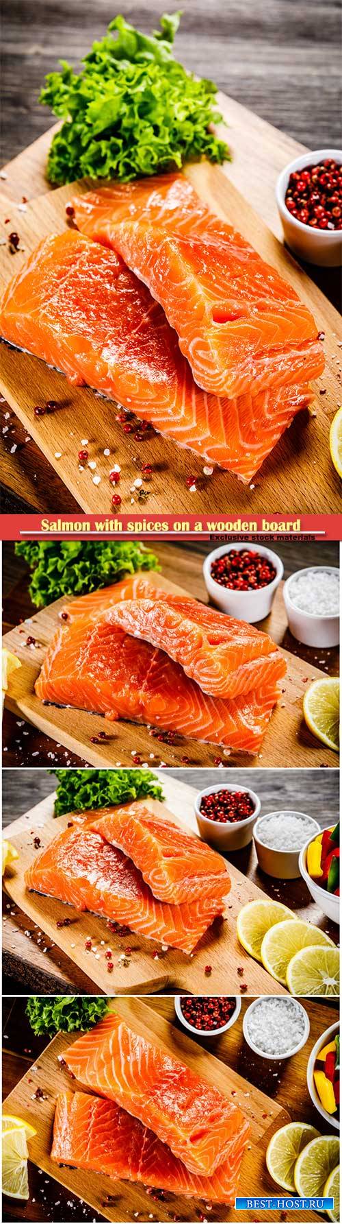 Salmon with spices on a wooden board