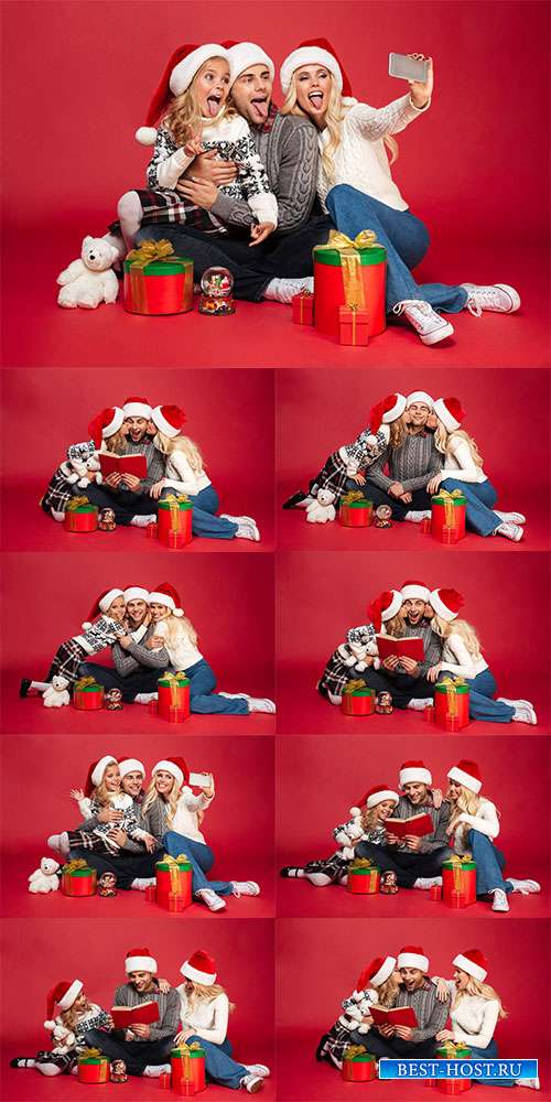 Счастливая молодая семья в новогодних колпаках - Фотоклипарт